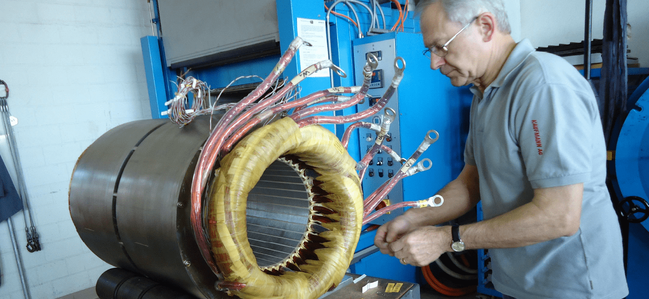 e+a USA worker assembling a induction motor